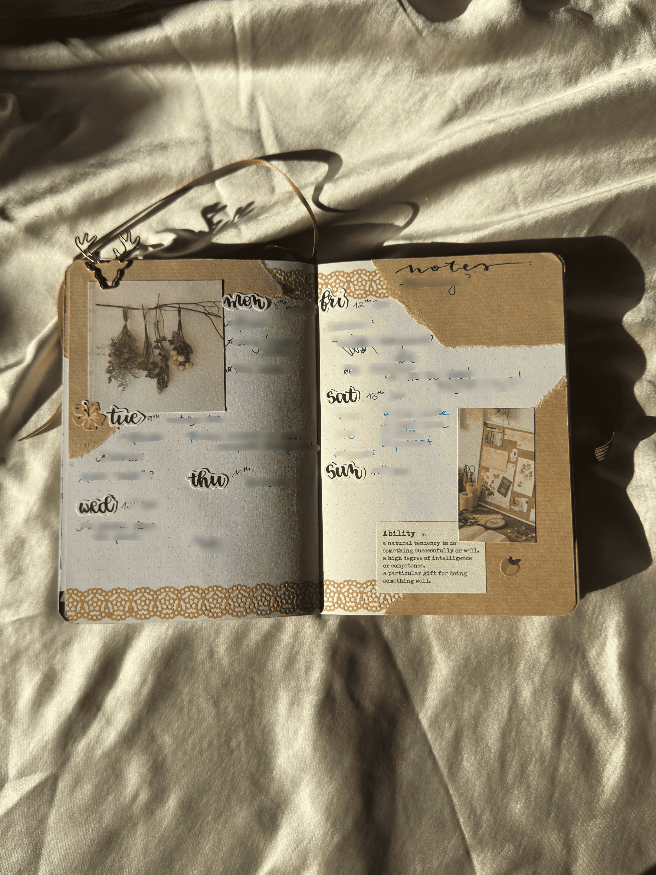 Open notebook with decorative cover on a textured surface