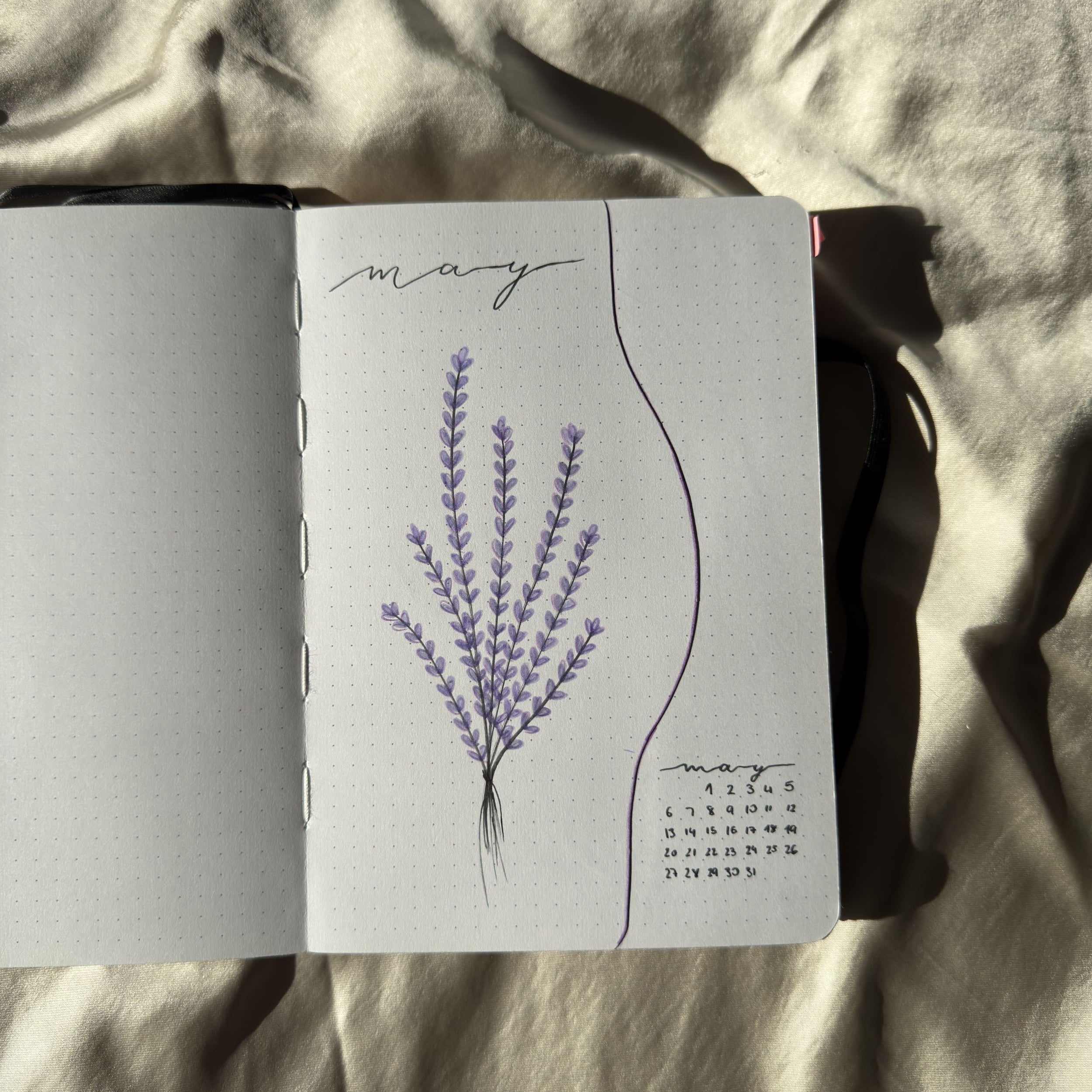 Notebook with lavender illustration on a textured surface